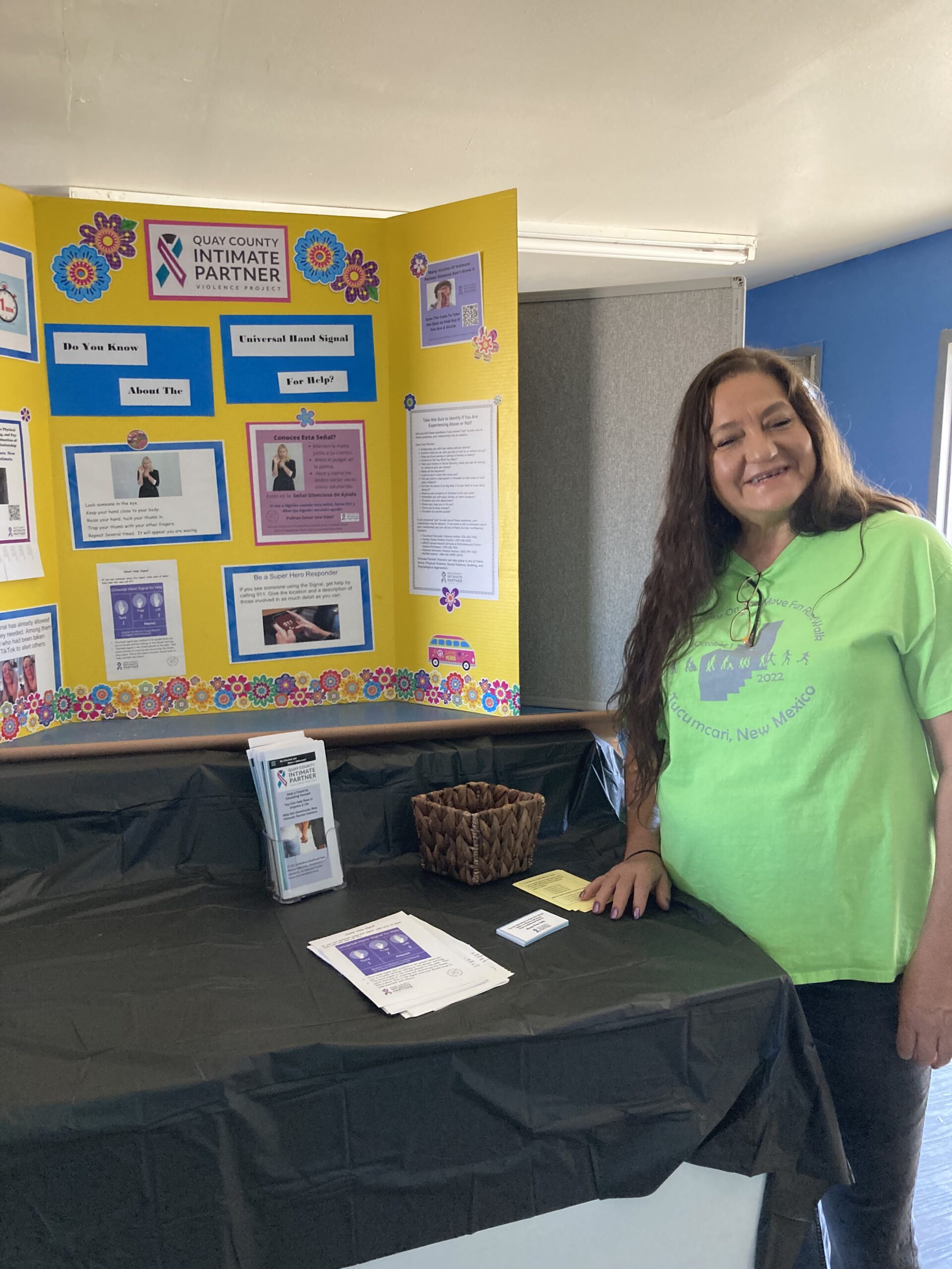 Smiling lady showing off a display.